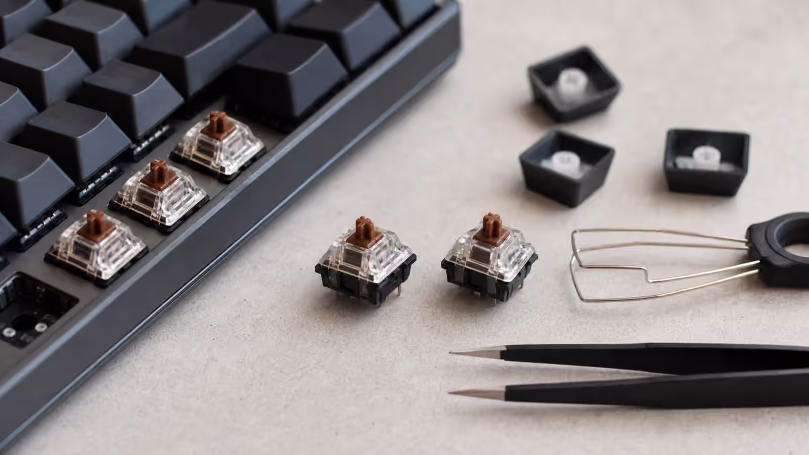 Mechanical keyboard switches and loose keycaps arranged for a stability check.