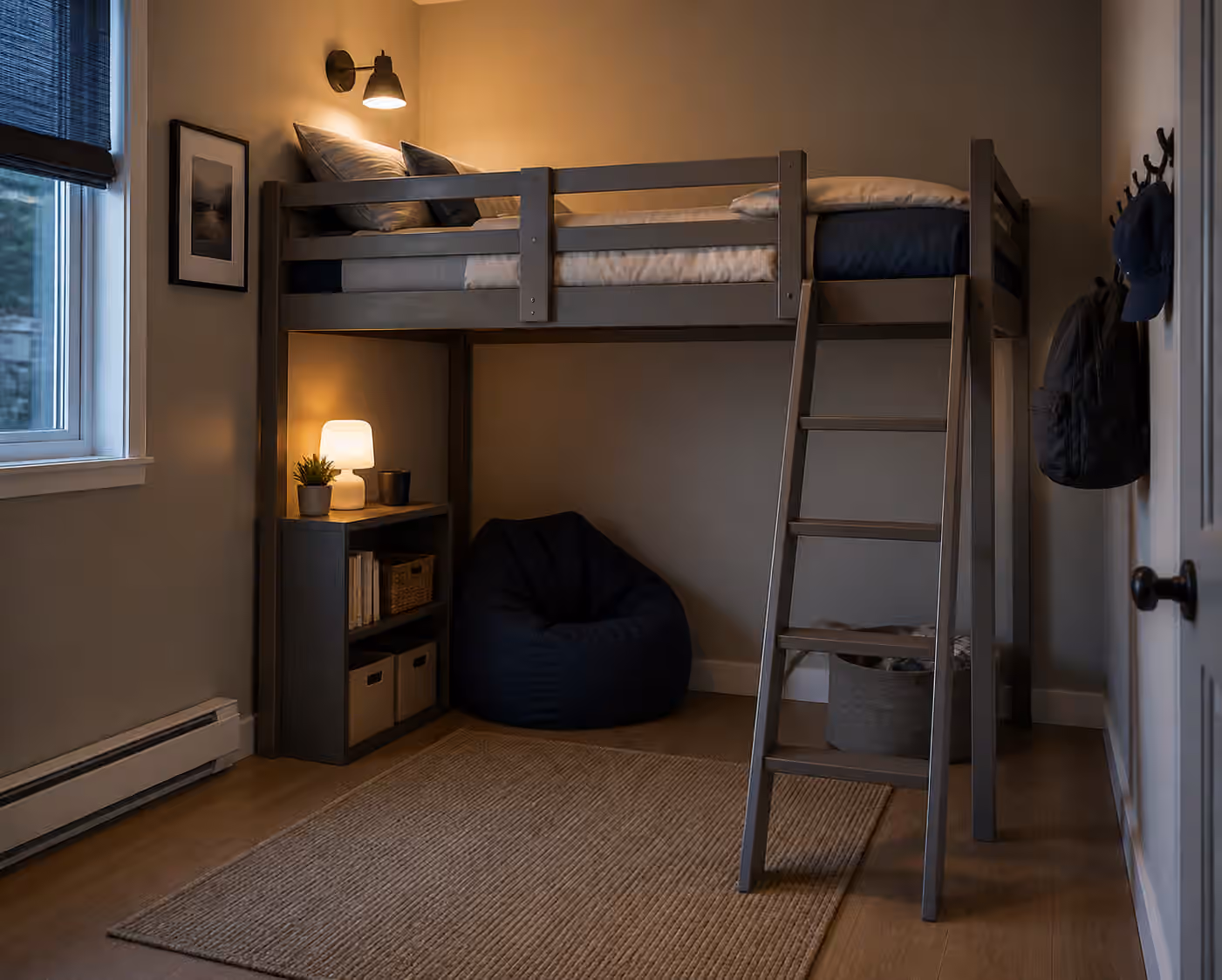 A compact bedroom with a loft bed, clear ladder access, soft wall light, and open floor space below.