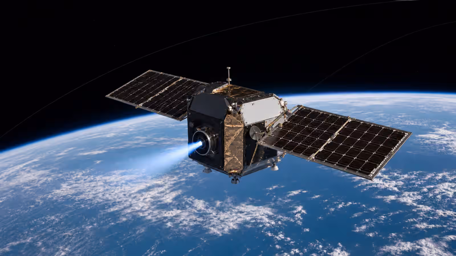 An unbranded satellite above Earth performs a modest blue electric stationkeeping burn with faint orbital path arcs in the distance.